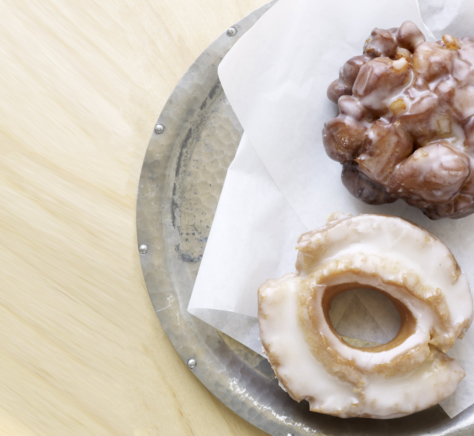 two doughnuts served on a plate